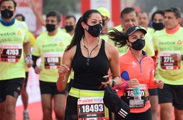 'My eyes are burning': Delhi holds half marathon